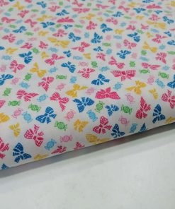 Tecido dos lacinhos com rebuçados